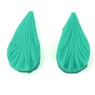 Detail view of green leaf-shaped silicone fondant mold with radial textured veins