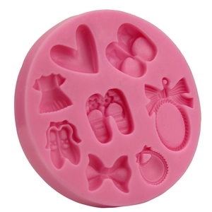 Pink silicone fondant mold featuring high-heel shoes, dresses and hearts for DIY baking