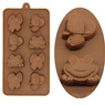 Detailed macro view of brown silicone mold featuring cute cartoon animal shapes for chocolate