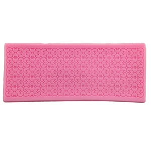 Pink rectangular lace silicone mold with floral and heart patterns for fondant cake decorating
