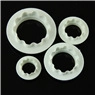 Detailed view of four white plastic circular cake cutters in various sizes for DIY baking