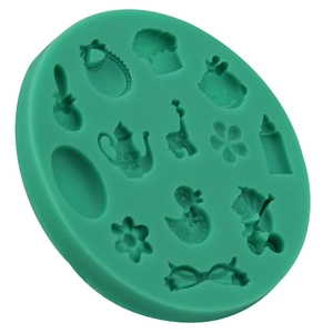 Green silicone fondant mold featuring baby shower shapes like strollers and giraffes