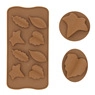 Macro detail of brown silicone chocolate mold with leaf and star shapes for DIY baking