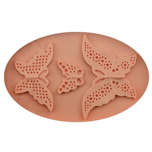 Pink silicone fondant mold with three sizes of detailed lace butterfly patterns