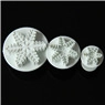 Three-piece set of white snowflake plunger cutters for fondant and cake decorating