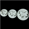 Detailed macro view of three butterfly-shaped fondant cutters in various sizes for baking