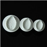 Detail of 3-piece white leaf-shaped plunger cutters with realistic vein texture