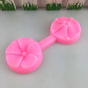 Pink silicone mold featuring two connected 5-petal flower designs for DIY baking crafts