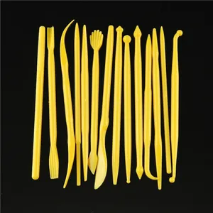 Professional 14-piece yellow fondant cake modeling tools set on a black background