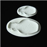 Detailed view of two white silicone hippo-shaped molds for fondant and DIY crafts