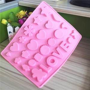 Pink silicone chocolate mold with LOVE and star shapes for baking and DIY crafts