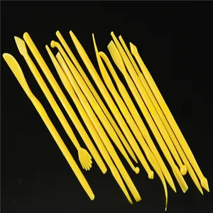 Macro shot of 14-piece yellow plastic fondant sculpting tool set for DIY cake decorating