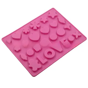 Detailed macro view of pink silicone LOVE heart and flower DIY baking mold cavities