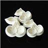 Detailed macro view of three white cherry-shaped plastic fondant stamps for cake decorating