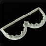 Detail of white plastic fondant mold with delicate scalloped lace edge for cake decorating