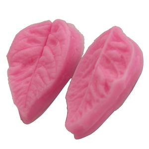 Two-piece pink silicone leaf mold set with realistic vein texture for DIY fondant baking