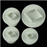 Set of four white plastic diamond-shaped fondant cutters with spring-loaded mechanisms