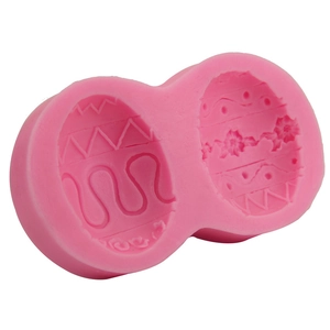Pink silicone Easter egg mold with wave and floral patterns for DIY chocolate baking
