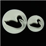 Detailed view of two white swan-shaped cookie cutters for DIY cake fondant and baking