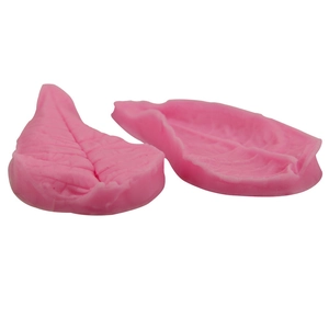 Pink leaf-shaped silicone fondant mold with detailed leaf vein textures for DIY baking