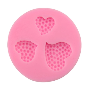 Pink silicone mold with three heart shapes for DIY fondant cake baking and chocolate