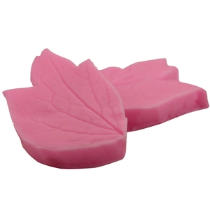 Pink silicone leaf vein fondant mold set for cake decorating on white background