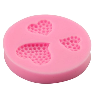 Pink heart-shaped silicone mold for fondant cakes and chocolate with honeycomb texture