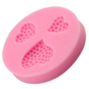 Pink heart-shaped silicone fondant mold with honeycomb texture for DIY cake baking