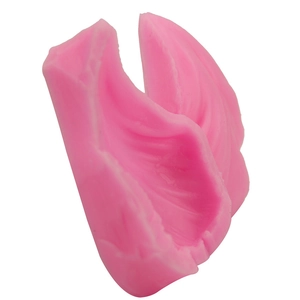 Pink silicone leaf mold for fondant cake decorating with detailed feather texture