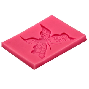 Pink butterfly silicone mold for DIY baking and cake decorating from a 45-degree angle