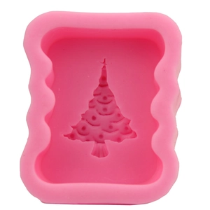 Pink silicone Christmas tree fondant mold with rectangular wavy edges for DIY cake decorating
