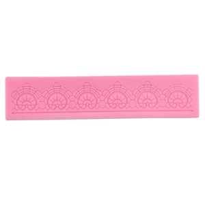 Pink silicone fondant mold with continuous fan-shaped lace pattern for cake borders