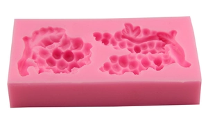 Pink rectangular silicone mold featuring detailed grape patterns for DIY fondant and chocolate