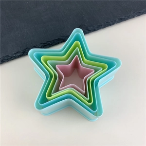 Set of 5 colorful star-shaped plastic cookie cutters for fondant and cake decorating