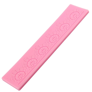 Pink silicone fondant cake mold with long floral lace patterns on white background