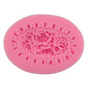Pink silicone flower mold for fondant and cake decorating featuring rose floral textures
