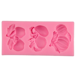 Pink silicone mold with 3 cavities featuring detailed plant and leaf vein textures