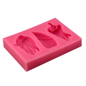 Pink silicone mold for fondant and chocolate featuring vegetable shapes like corn and leaves