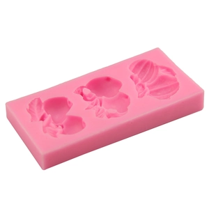 Pink silicone mold with three pumpkin shapes for DIY fondant cakes and chocolates