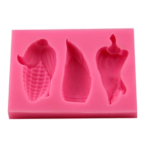 Pink silicone DIY mold with corn bamboo shoot and chili shapes for fondant and chocolate
