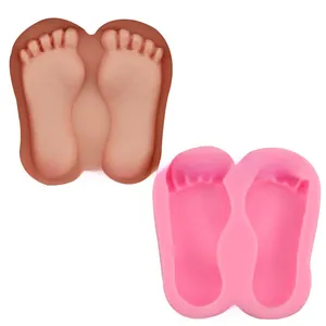 Macro view of flexible silicone molds in pink and brown with 3D paw print shapes