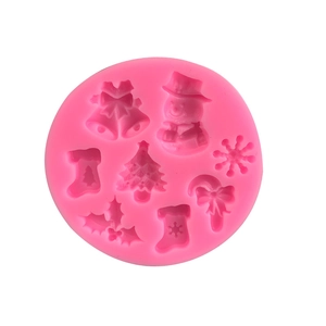 Pink silicone mold featuring Christmas tree, snowman, and snowflake shapes for DIY baking