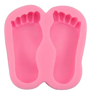 Pink silicone baby feet fondant mold with dual symmetrical design for DIY baking and crafts