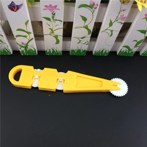 Multifunctional yellow rolling dough cutter with three white gears for DIY fondant and pastry
