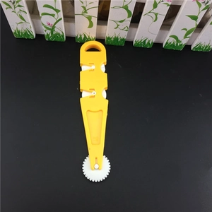 Multifunctional yellow pastry rolling cutter with ergonomic handle and serrated wheel
