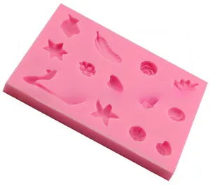 Moule détaillé en silicone rose avec 11 formes de coquillages, étoiles et de fleurs