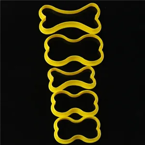 Five-piece yellow bone-shaped plastic cookie cutters for DIY baking and dog treats