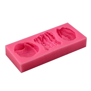 Pink silicone vegetable leaf mold for fondant chocolate and DIY baking tool on white background