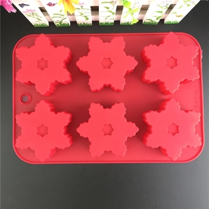 Red 6-cavity snowflake silicone cake mold for DIY Christmas baking with hanging hole