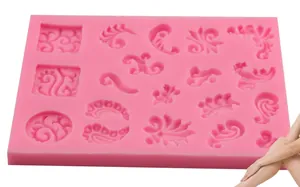 Pink silicone fondant mold with multi-cavity baroque floral and scroll leaf patterns